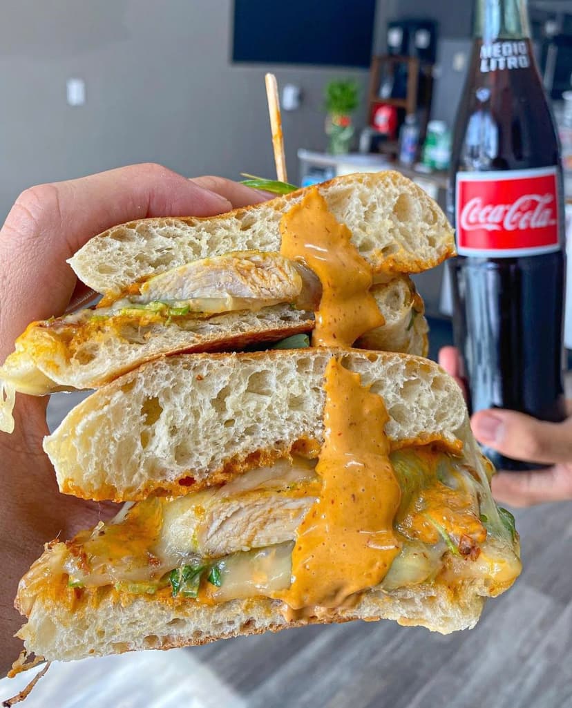 Spicy chicken sandwich with jack cheese and spicy mayo on rustic bread